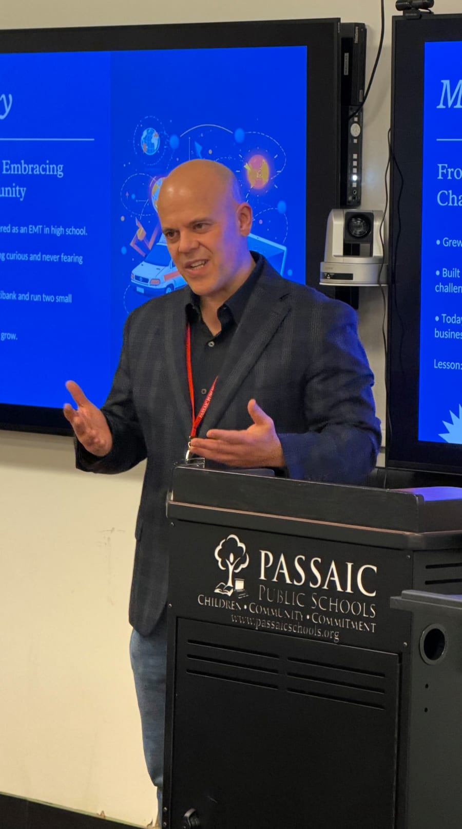 Moses Acosta presenting on artificial intelligence at a New Jersey public school.